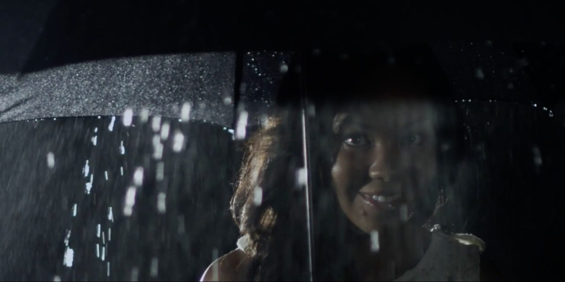 Headshot from Classic: Jessica Burrows under a black umbrella.