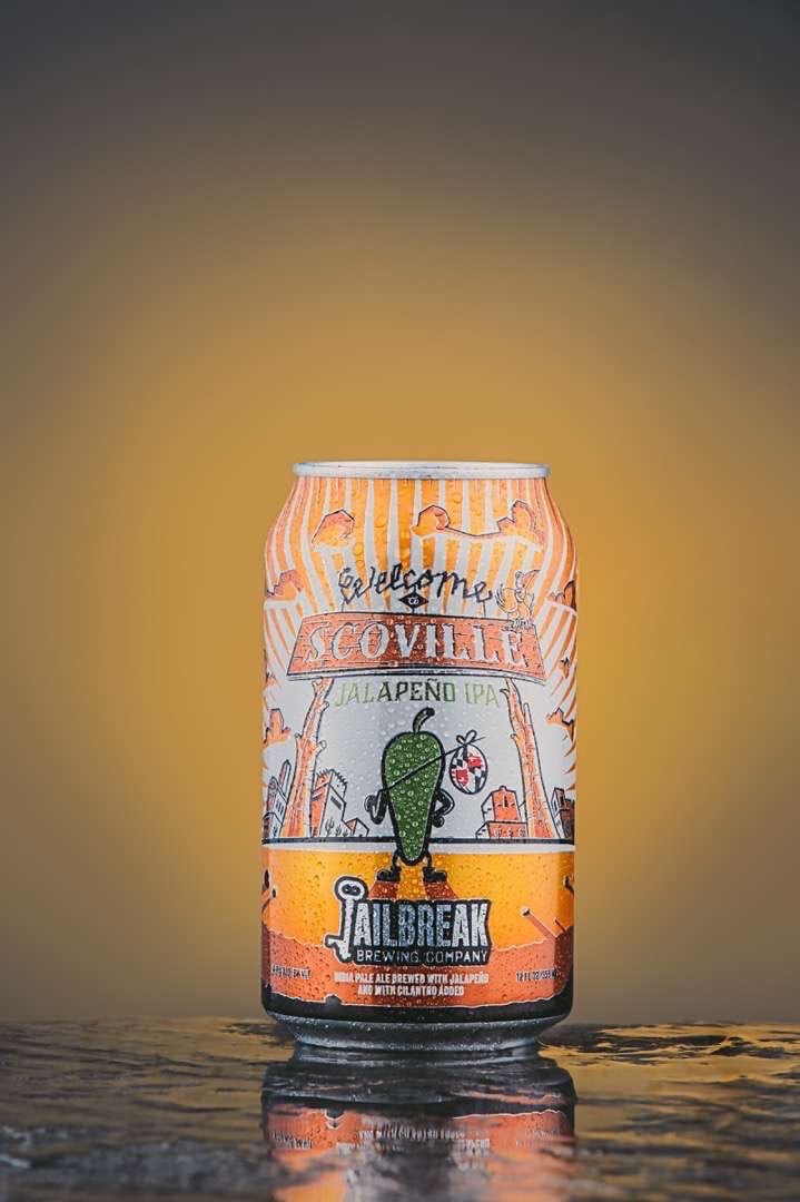 Jailbreak Brewing Closeup of a mostly orange colored can of "Scoville Jalapeno IPA" drink made by Jailbreak Brewing Company.