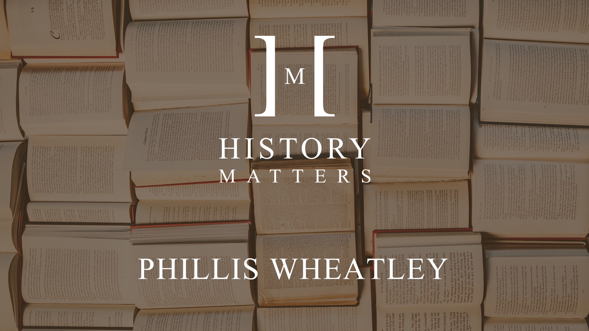 IU C&I Studios Page White HM Phillis logo with dimmed background of a bunch of opened books on display