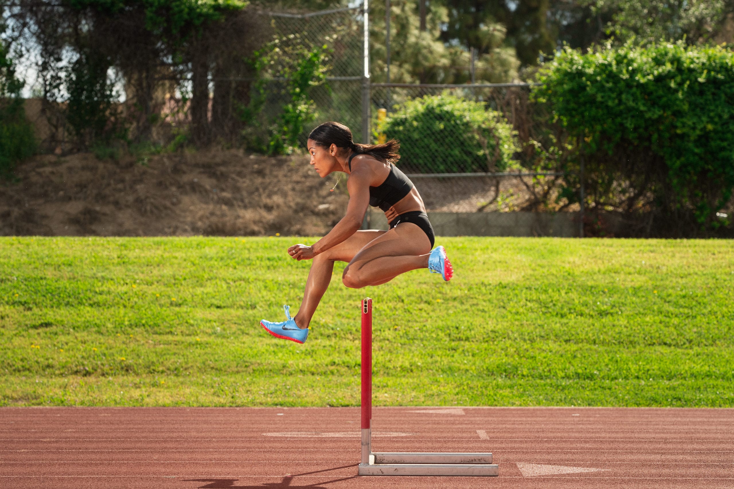 Karelle Edwards jumping a hurdle