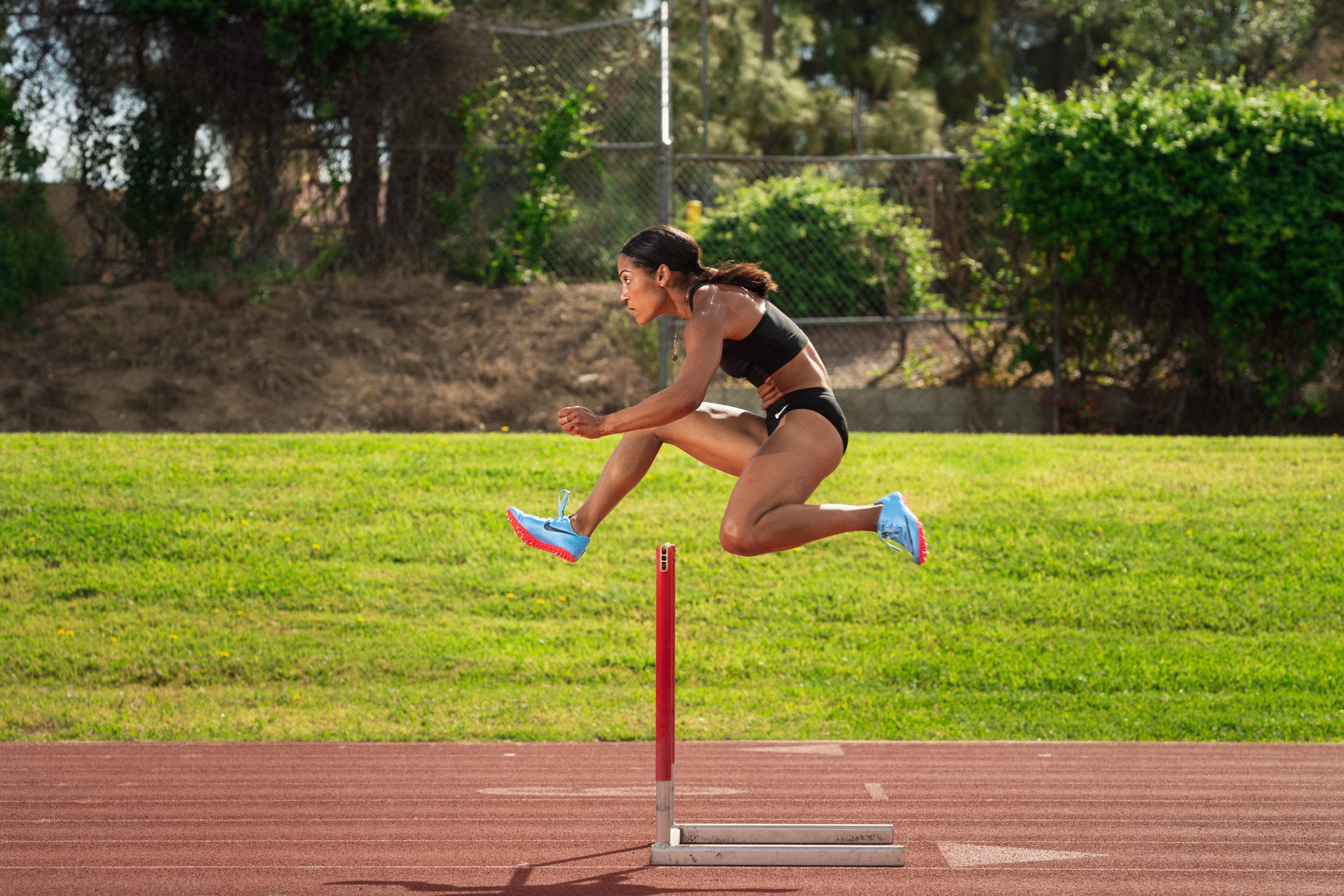 Karelle Edwards jumping a hurdle