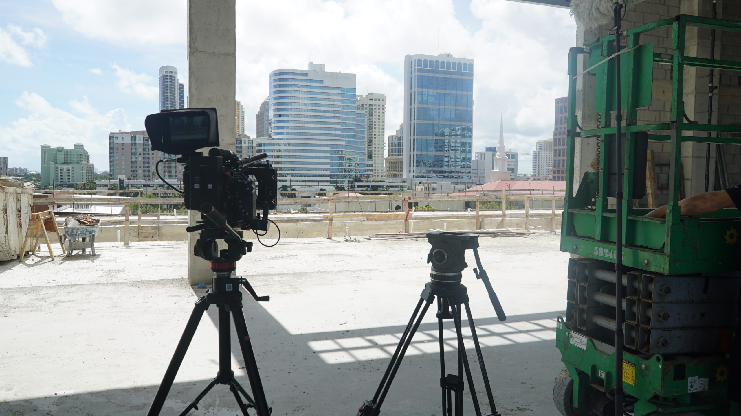 Camera equipment set up with city buildings in the background