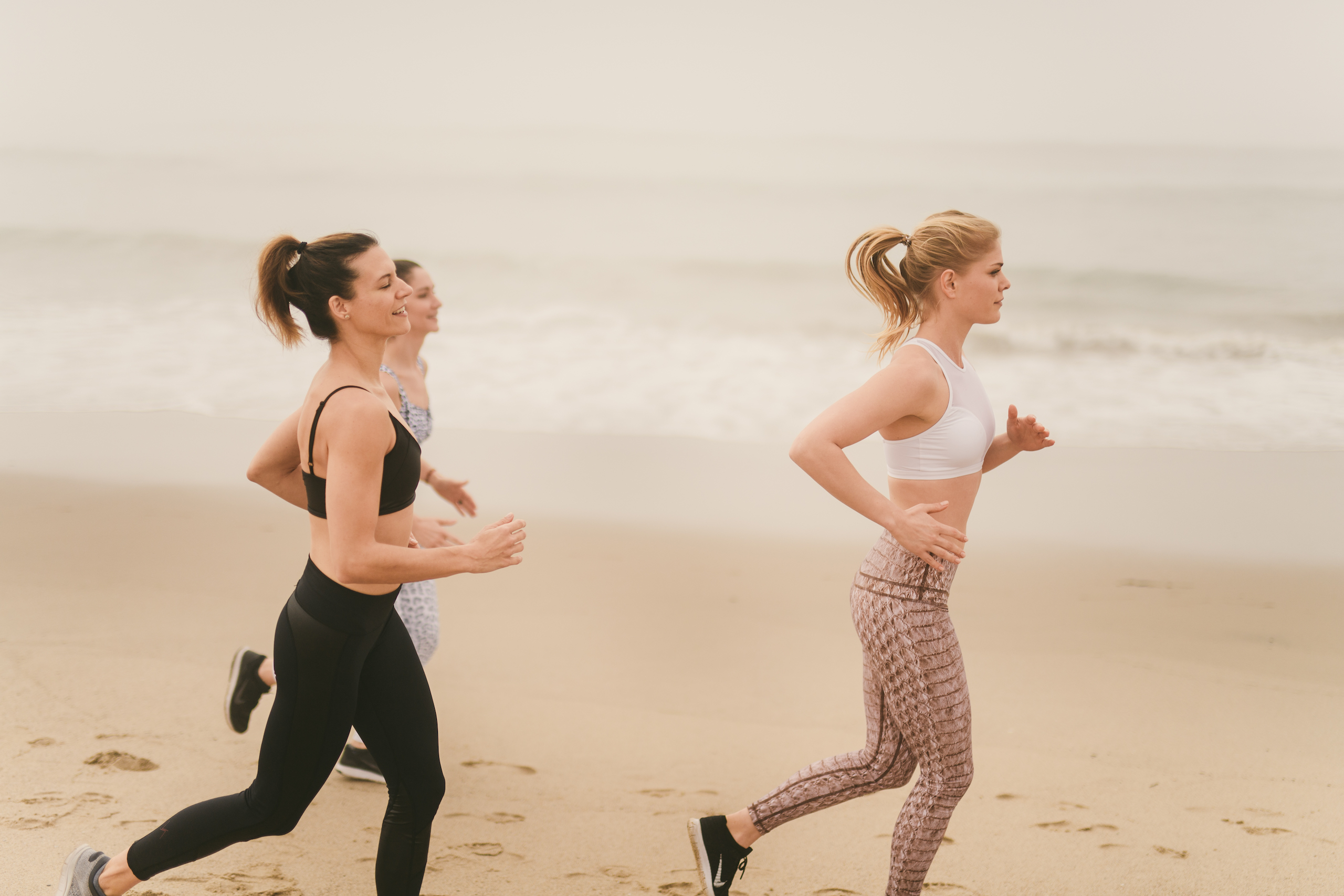 Health and Fitness Marketing Kinetix 365 Beach Exercises Three women running in the sand
