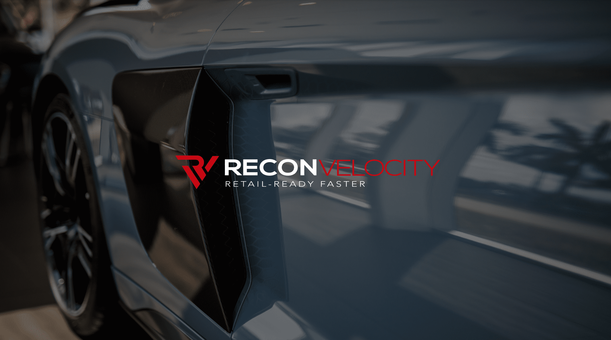 IU C&I Studios Page White and red Recon Velocity logo with a side view of a luxury car in the background