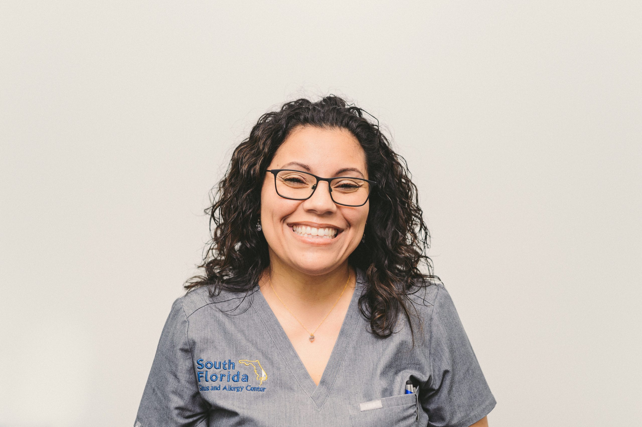 South Florida Sinus and Allergy Center Headshot of a female doctor posing and smiling for the camera