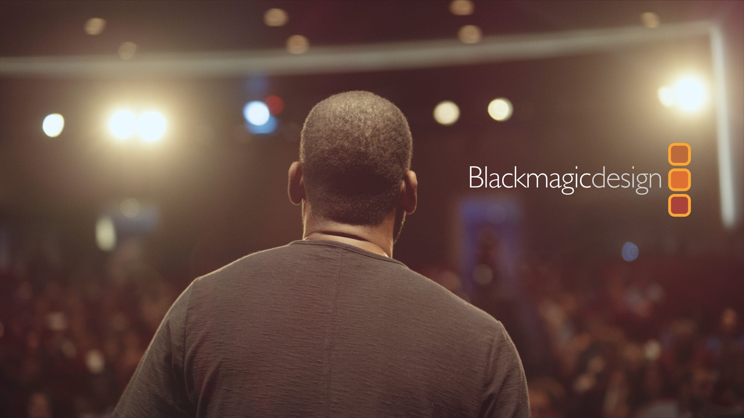 IU C&I Studios Page Editfest 2019 sponsored by Blackmagic Design logo with view from behind of a man addressing an audience in the background