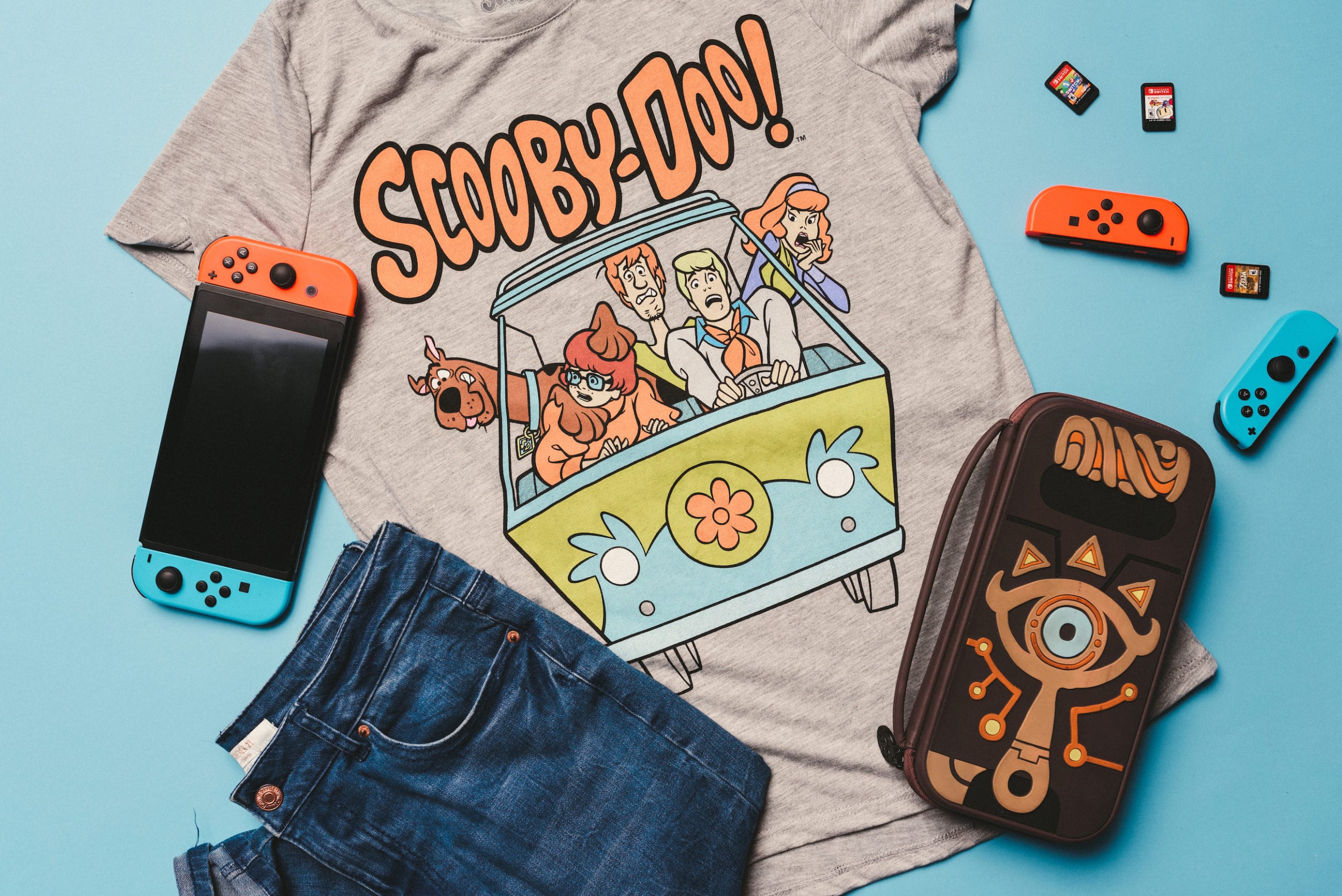 Heart Piece Plus Media Day Branding Gray Scooby Doo t shirt, jeans, game controller and purse on display