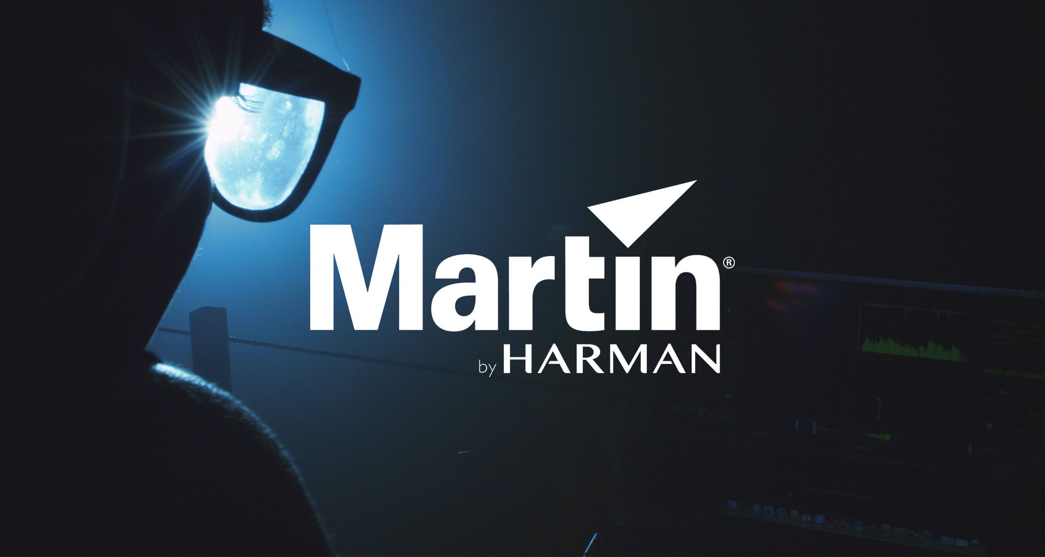 IU C&I Studios Page White Martin by Harman Lighting logo with background side profile looking through glasses of a person from behind