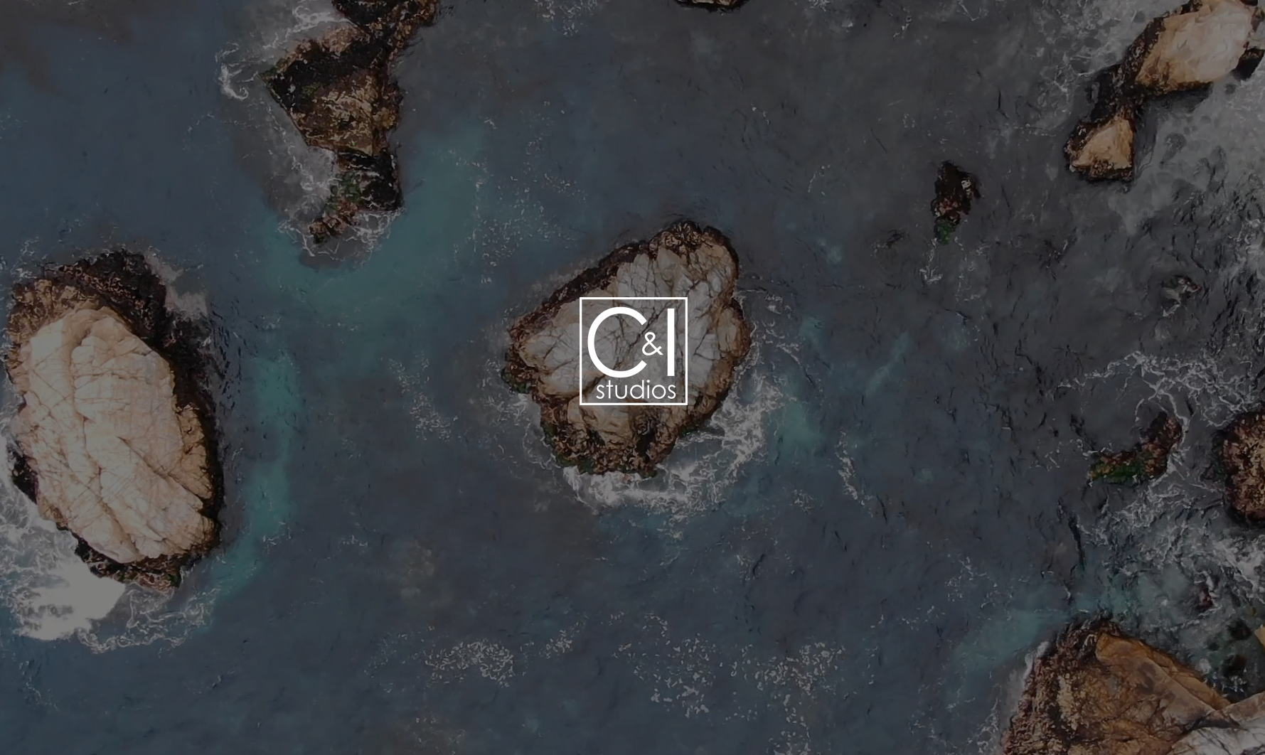 IU C&I Studios Page CI Reels Featured Image Aerial view of rocks in an ocean