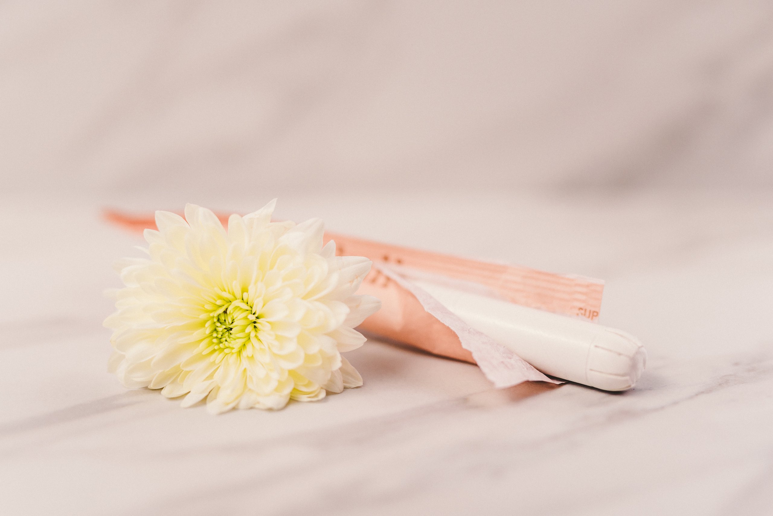 Closeup view of tampon with white flower