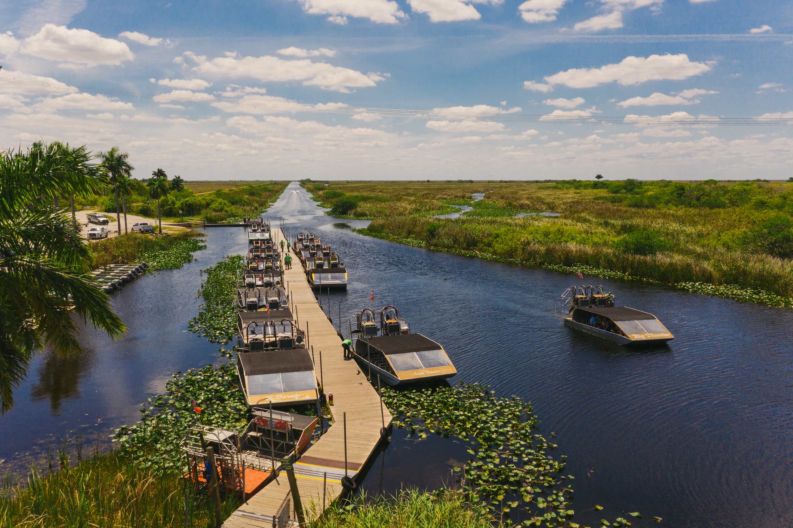 Aerial view of airboats by a dock in the water
