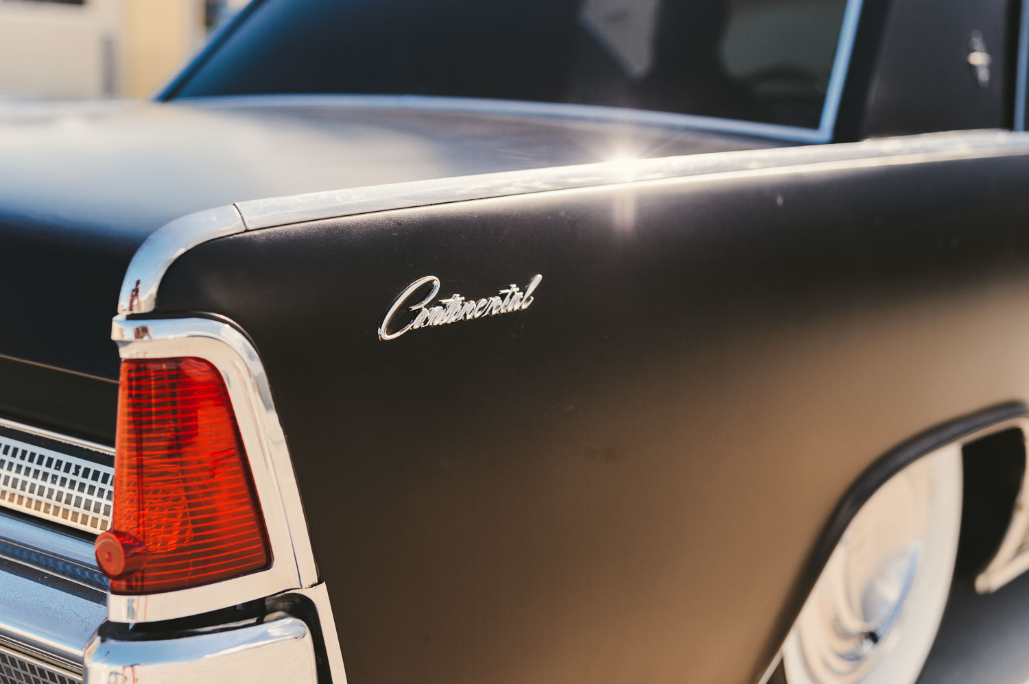 Closeup of Chevrolet logo on side of black car