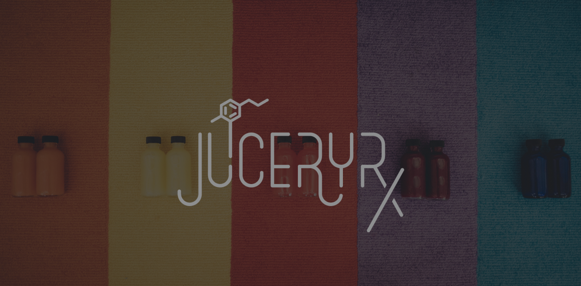 White JuiceryRX logo Creative Marketing with dimmed background showing multiple colors of bottles laying on colored strips