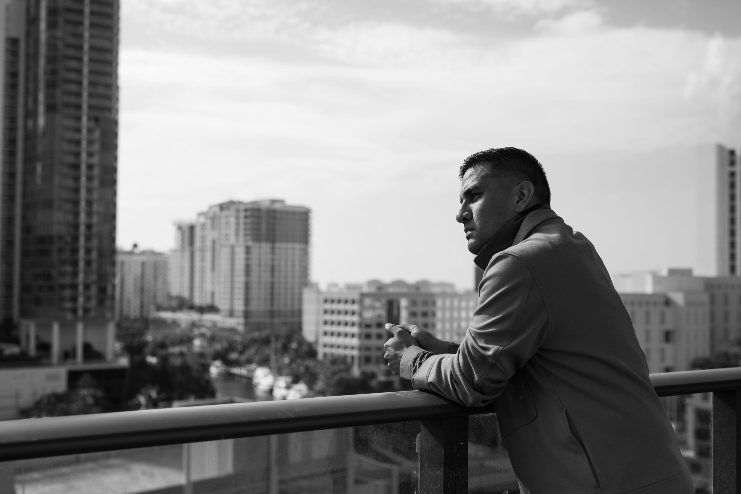 Fort Lauderdale Illustrated Men of Style Black and white of male model standing on a balcony