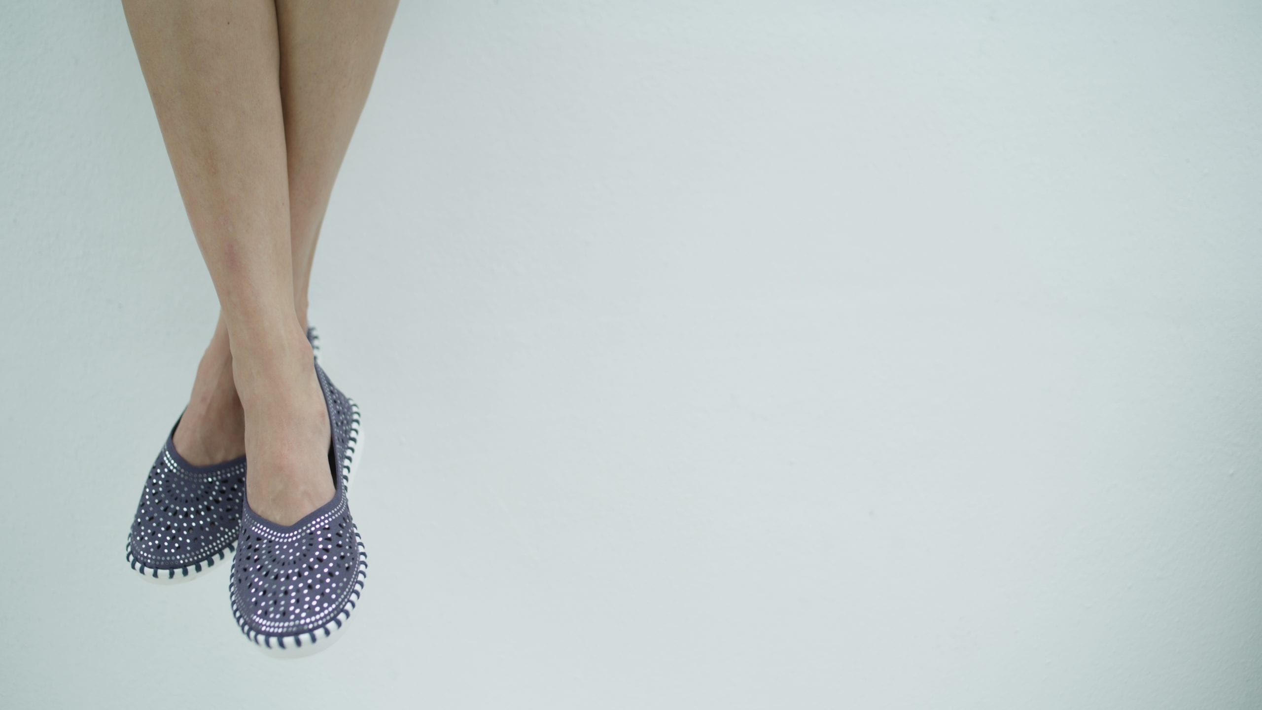 Spring StepPatrizia Flexus Dovi Maiwenn Blue Closeup of black and white shoes being worn by female model