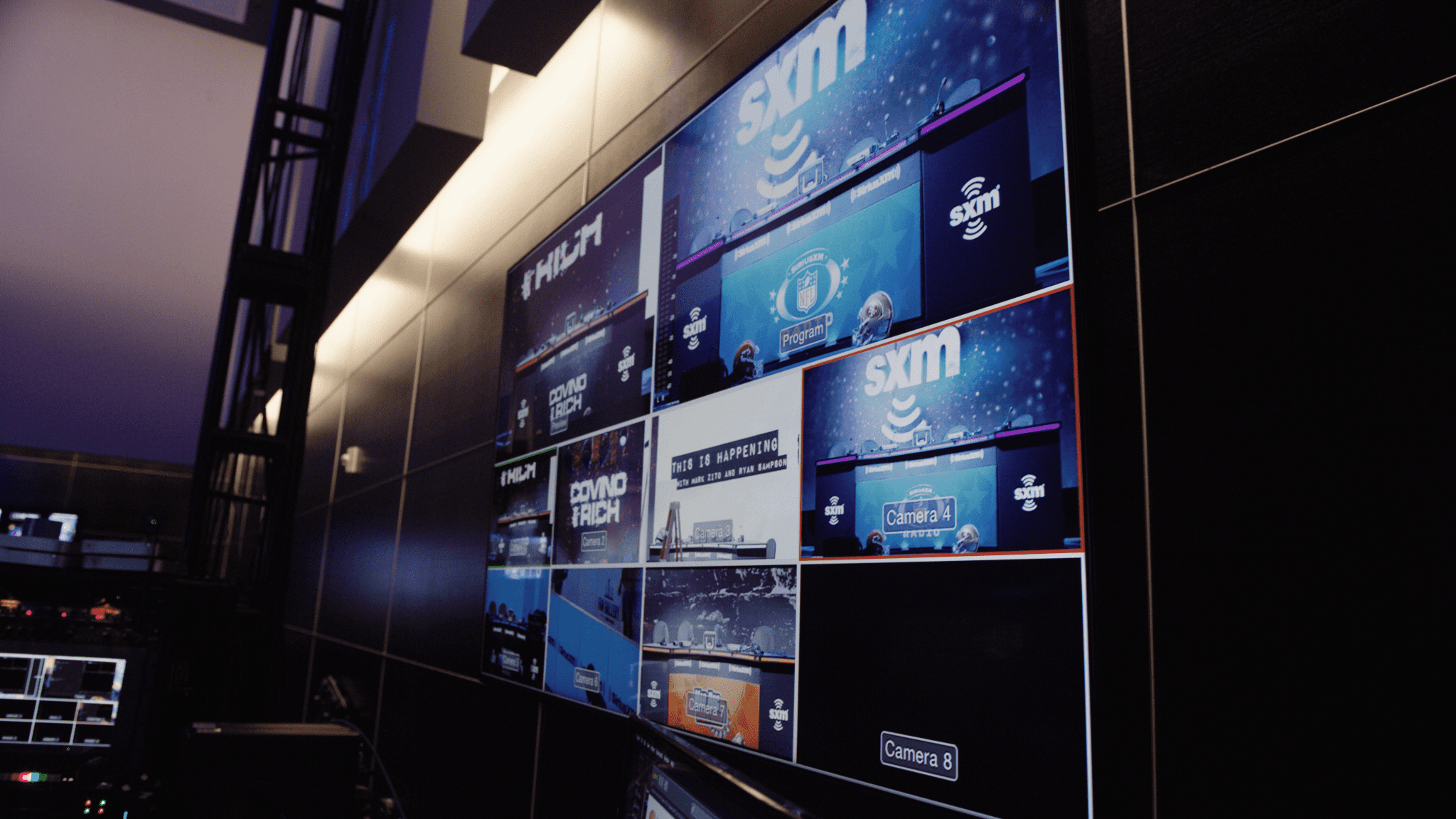 Professional Video Creation Service SiriusXM wall display of video bank