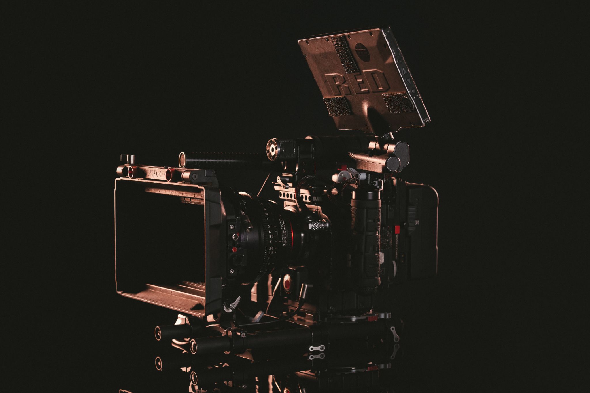 When to Use Photography vs. Video in Your Marketing Side profile of RED camera