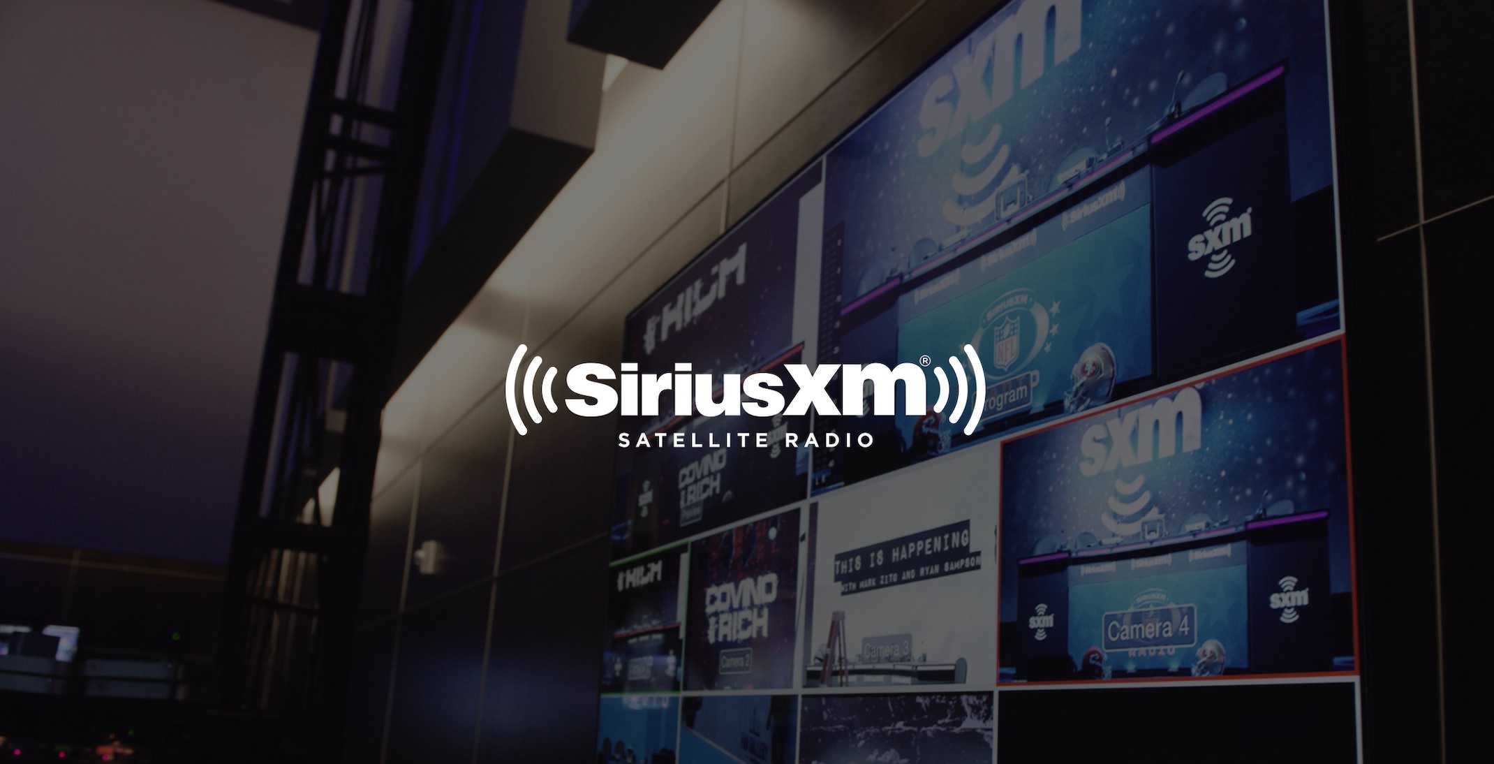 White Sirius XM Satellite Radio logo with dimmed background of video bank