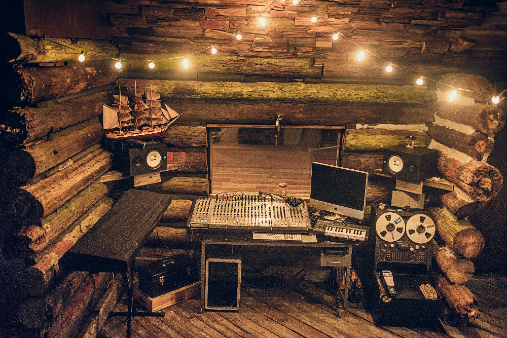 The Many Benefits of Recording Audio in a Professional Studio Audio equipment on display in a makeshift cabin