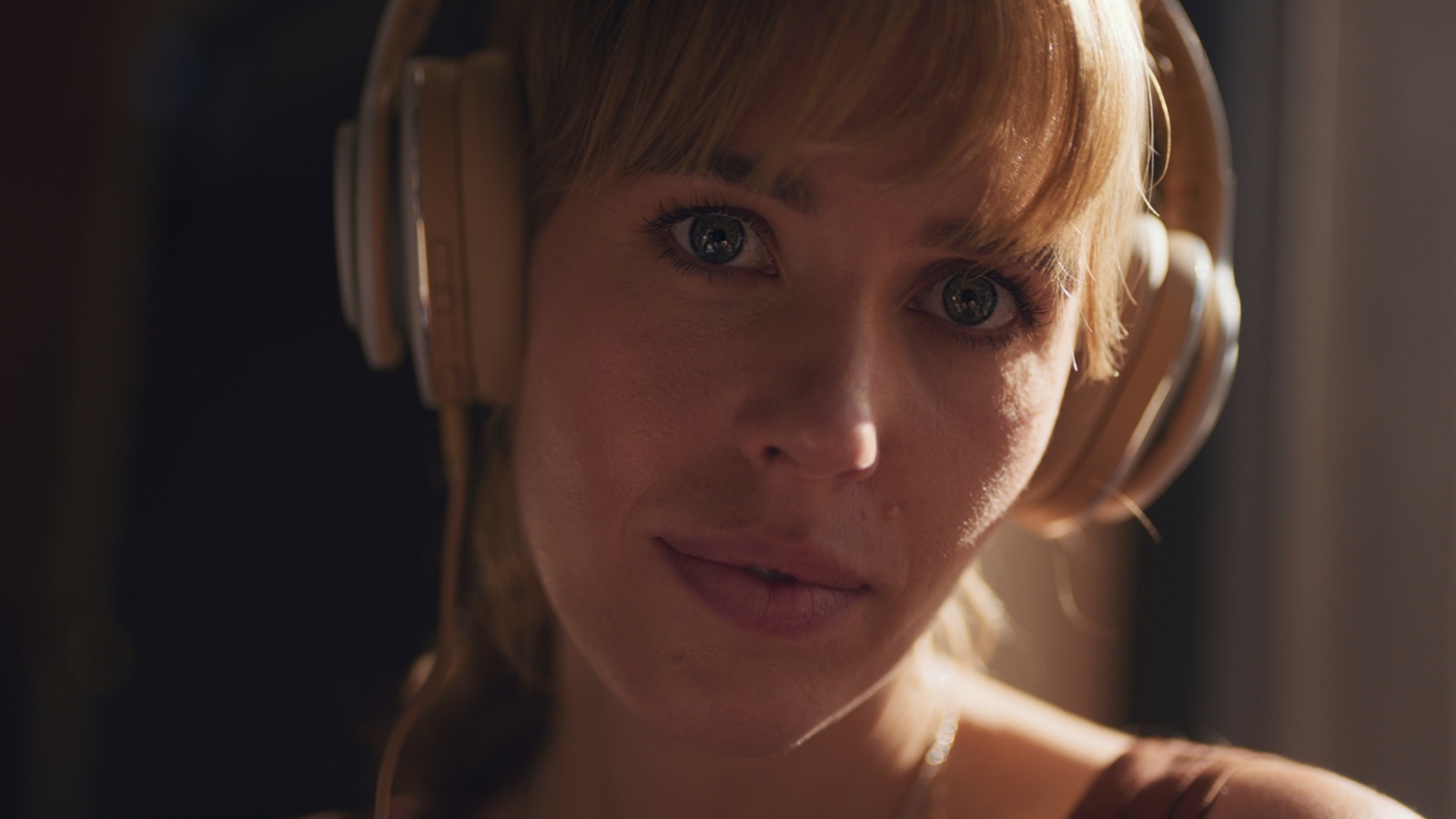 Recipe for Creating a Short Film Headshot of woman with long blond hair wearing light colored headphones posing for the camera