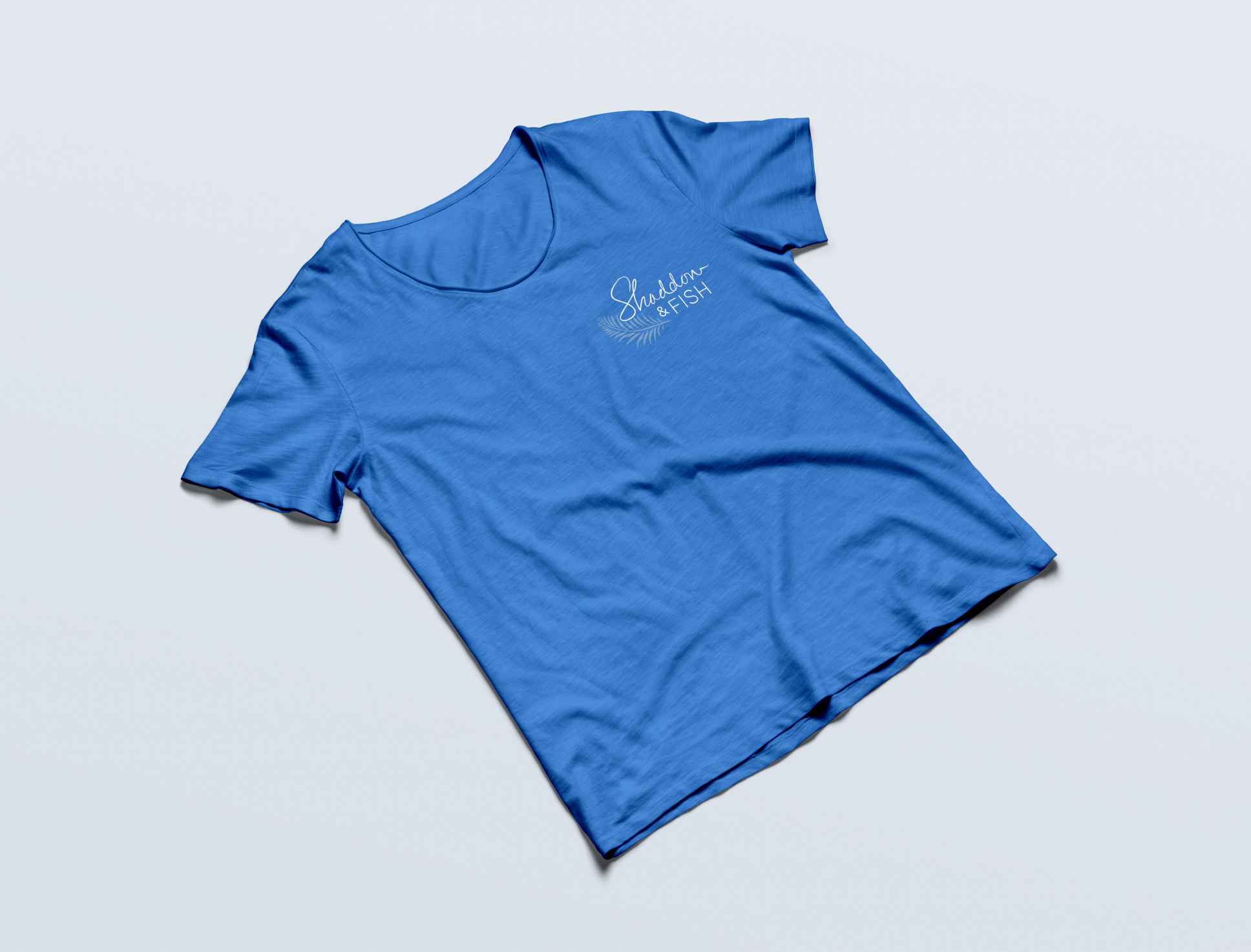 Logo Design Light blue Shaddon & Fish t shirt on display