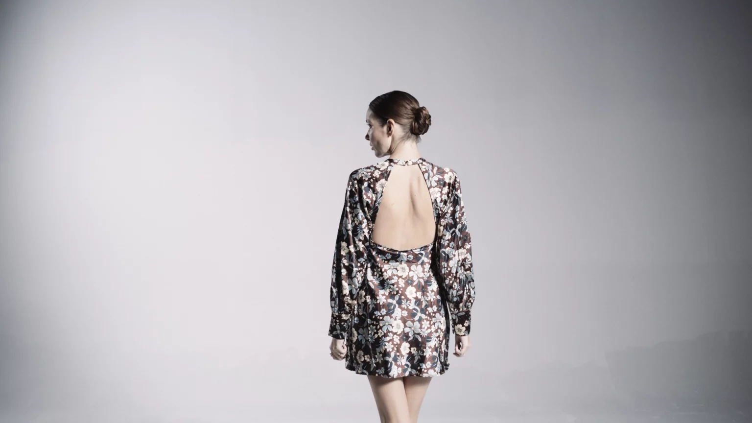 View From Behind Of Woman Wearing A Flowery Outfit